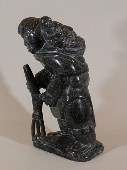 Evie -&nbsp;Woman with baby and fish spear